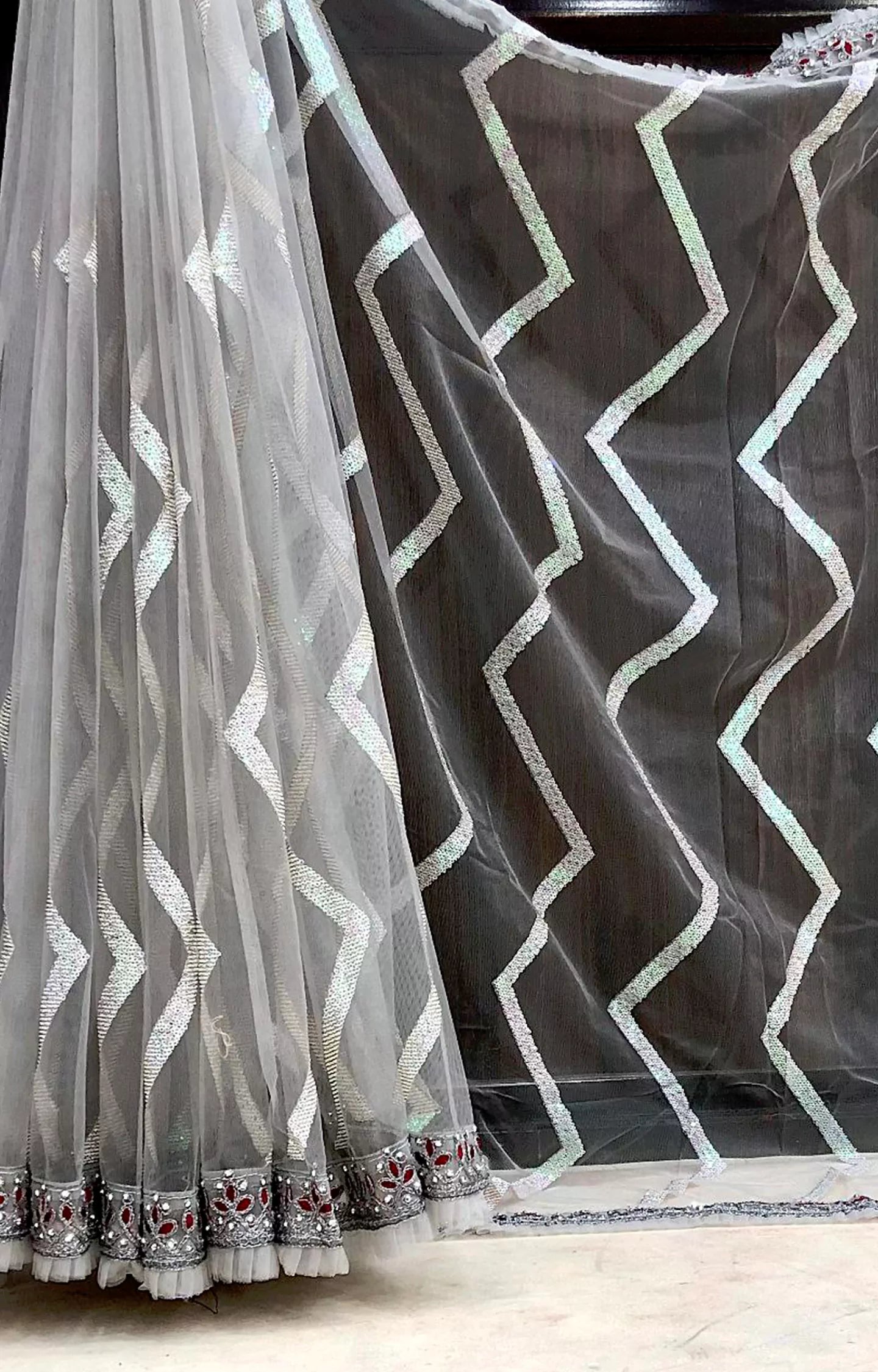 TUFIYA MONO NET FABRIC WITH ZIGZAG SEQUENCE WORK SAREE.